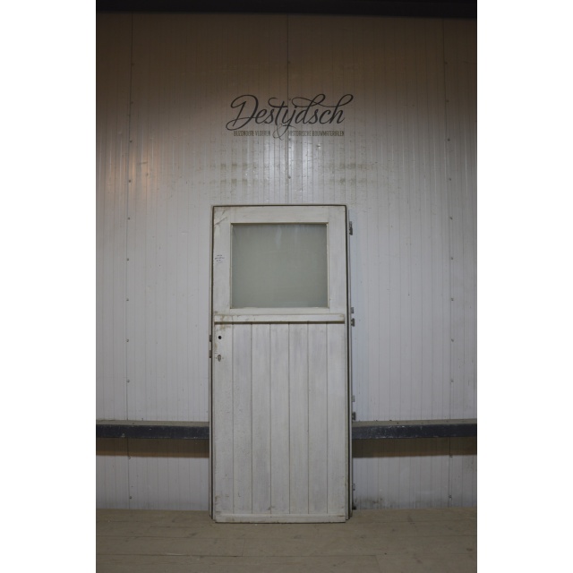 Oude buitendeur met glas 